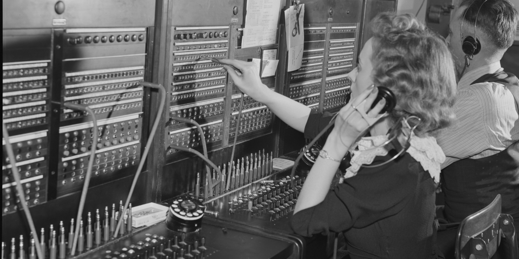 Kansas City, Missouri. Private branch exchange (PBX) operator at her switchboard in the freight depot.